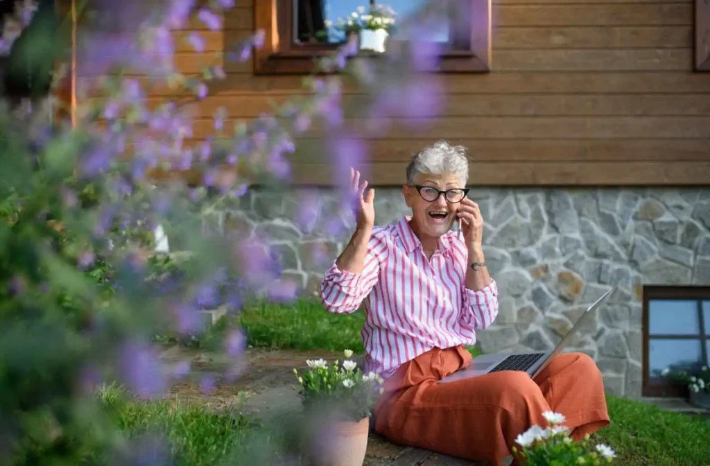 Happy senior woman with smartphone 