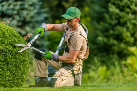 Guide on Garden Worker Trimming Plants During Spring
